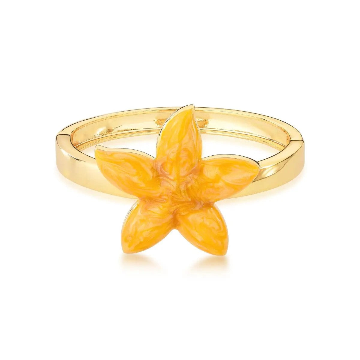 Gold ring with a yellow flower-shaped stone on a white background