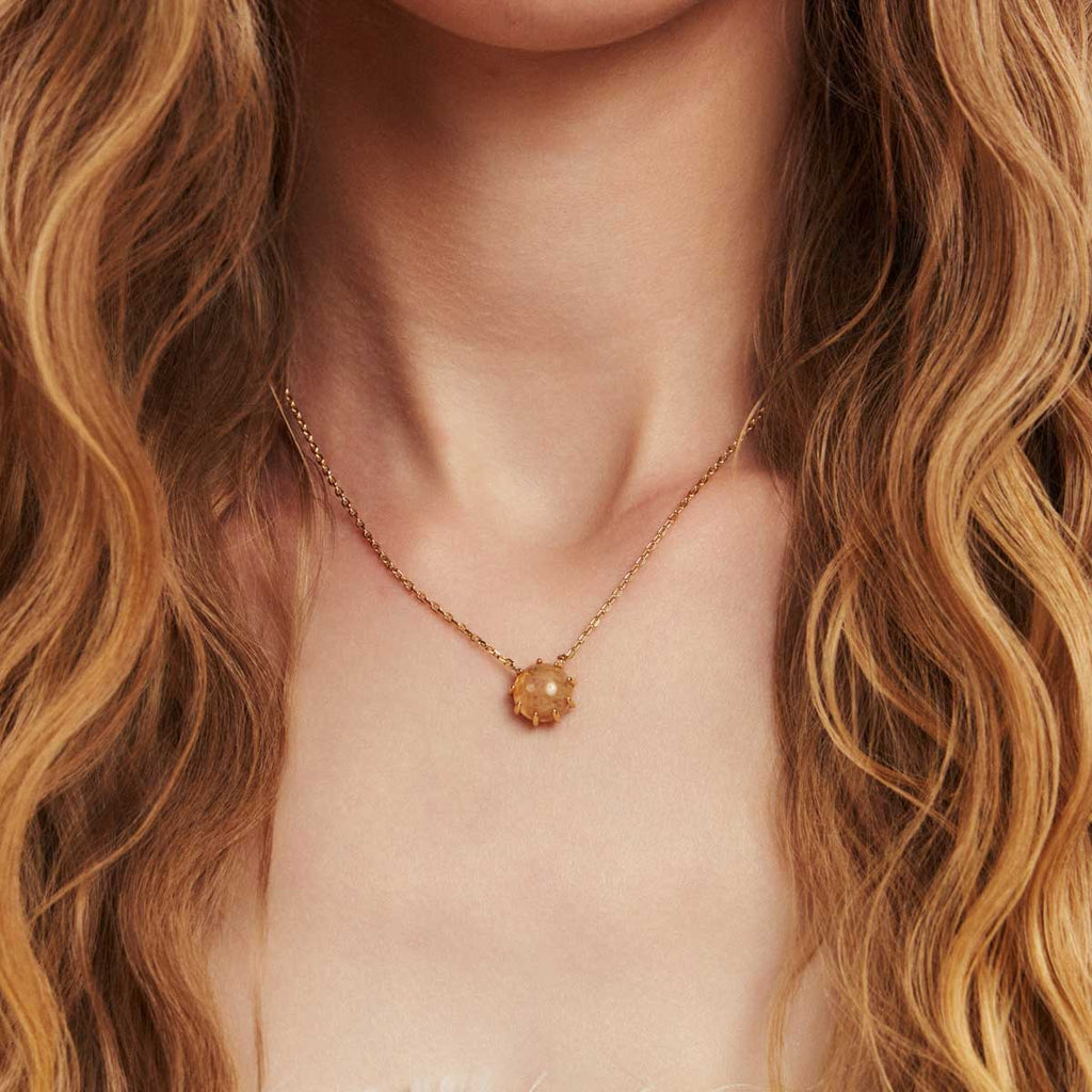Collier avec pendentif rond en quartz rutile