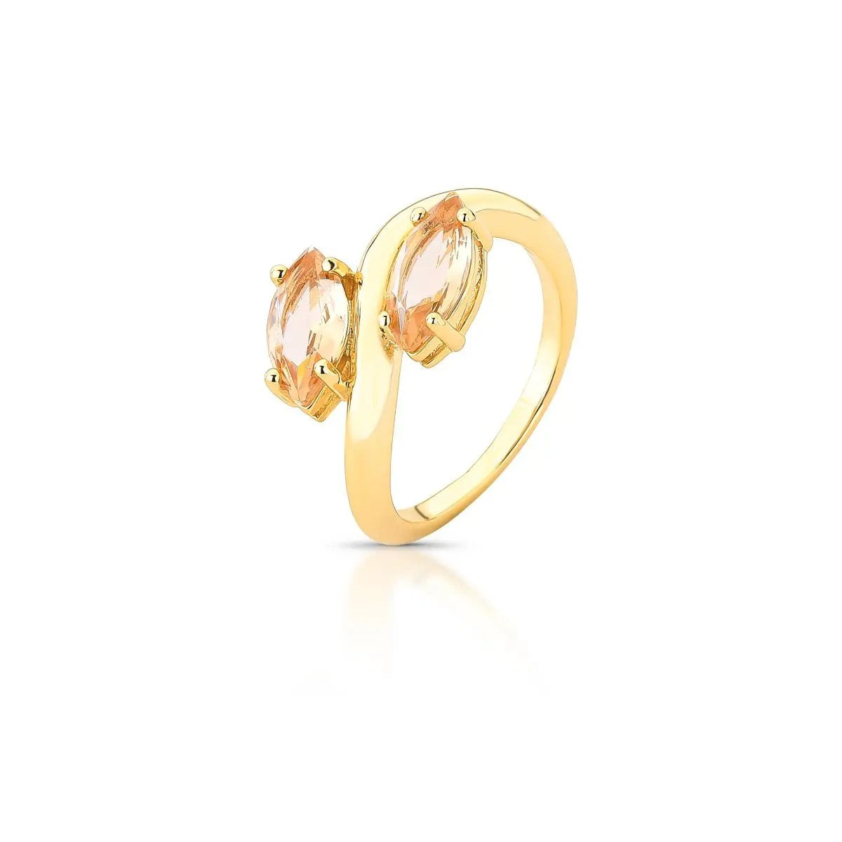 Gold ring with peach-colored gemstones on a white background