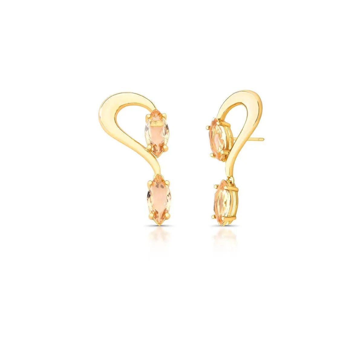 Gold earrings with peach-colored gemstones on a white background