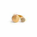 Adjustable ring featuring a brushed-gold finish and sparkling zirconia accents.